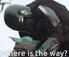 The Mandalorian holding Grogu asking where is the way