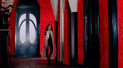 Woman in red hallway