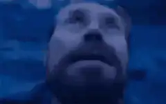 Man rolling eyes back in head