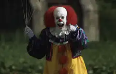 Pennywise holding balloons