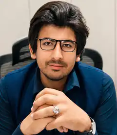 Man in glasses with large ring
