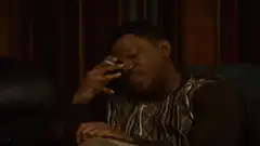 Man smoking cigarette on forehead
