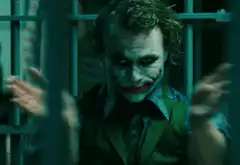 Joker clapping behind bars