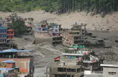 Houses buried in mud after landslide