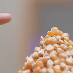 finger touches popcorn with lightning