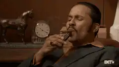 Marlo Stanfield lights a cigar