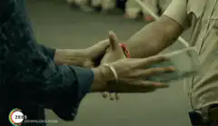 Handing over money to a police officer