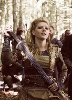 Valkyrie draws sword in forest
