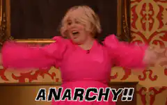 Woman in pink dress shouting ANARCHY