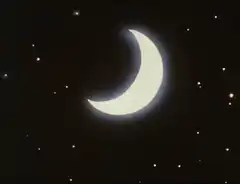 crescent moon hit by laser beam