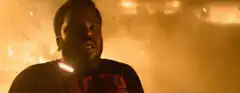 Man screaming in front of fire