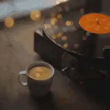 vinyl record player and coffee cup