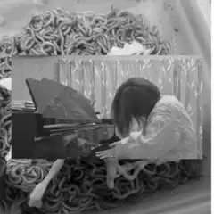 woman playing piano in a bowl of noodles