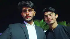 Two men with butterfly face filter