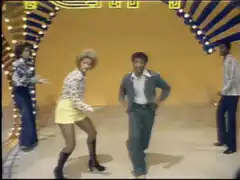 Man and woman dancing on a stage