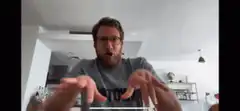 Man doing the claw hand gesture