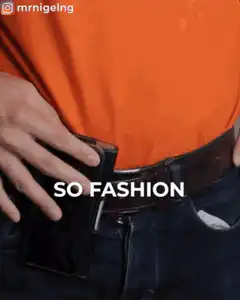 Man in orange shirt showing wallet in pocket