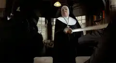 Sister Mary Clarence hits people with a rolled-up paper