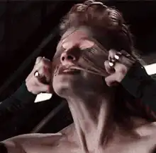 Woman peeling off her face mask