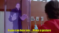Ghost man behind glass making gestures