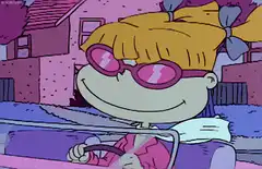 Angelica driving with sunglasses