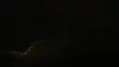 lightning bolt in dark storm clouds