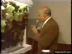 Man walks past grapes