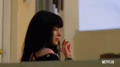 Jessica Jones looks up with a skeptical expression