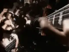 Guitarist playing over crowd at concert