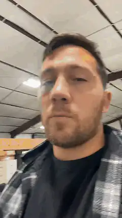 man looking around with puffed cheeks