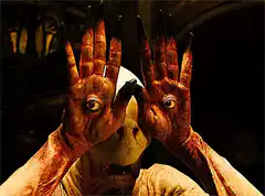 Demon with eyes on hands