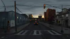 Car driving down a street at dusk