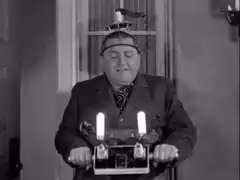 Man with electric shock machine on head