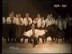 Man dancing with arms outstretched