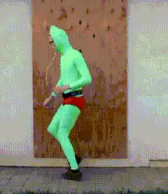 Man in green bodysuit dancing