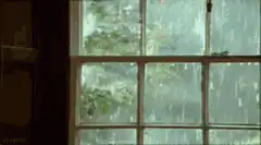 Rain falling outside a window