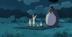 Totoro holding an umbrella in the rain
