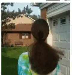 Girl turns around with sunglasses and braces