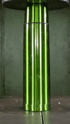 Green cylinder crushed by hydraulic press