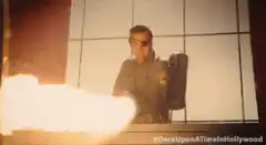 Arnold Schwarzenegger with a flamethrower
