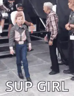 Young boy in cowboy hat dancing