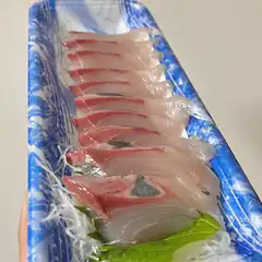 sashimi on blue and white plate