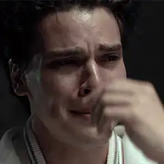 Crying man covering mouth
