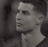 Cristiano Ronaldo looking up and smiling