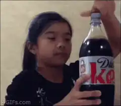 Girl shakes Diet Coke bottle