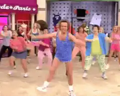 Billy Ray Cyrus dancing in a blue outfit