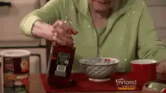Betty White pouring syrup on cereal