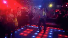 Man dancing on light-up dance floor