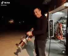 man holding tesla coil