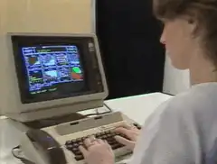 Person typing on vintage computer
